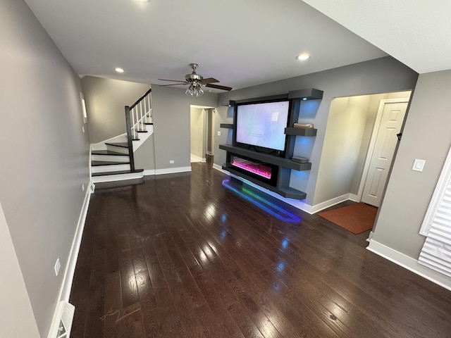 unfurnished living room with wood-type flooring, recessed lighting, a ceiling fan, and baseboards