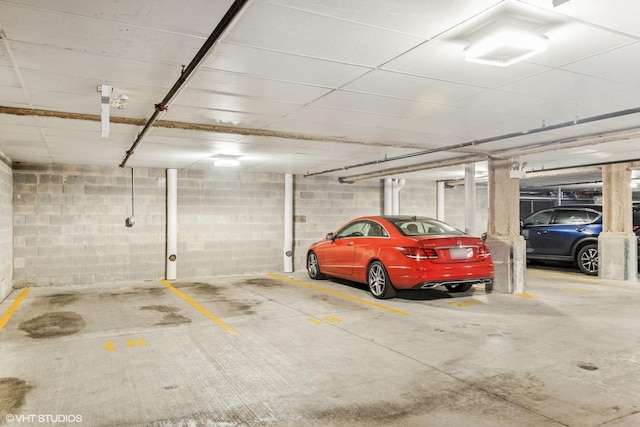 parking deck with concrete block wall and a garage door opener