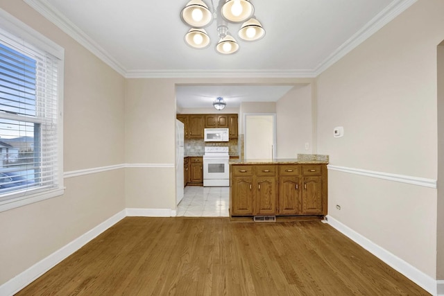 2232 S 2nd Ave, North Riverside, IL 60546 - unfurnished living room featuring wood finished floors, visible vents, a chandelier, and arched walkways