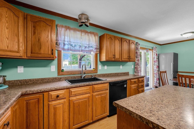 3504 Royal Oak Ct, Champaign, IL 61822 - kitchen with dishwasher, plenty of natural light, brown cabinetry, crown molding, and light wood-style floors