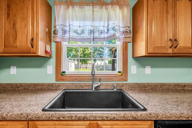 3504 Royal Oak Ct, Champaign, IL 61822 - kitchen with brown cabinetry and dishwasher