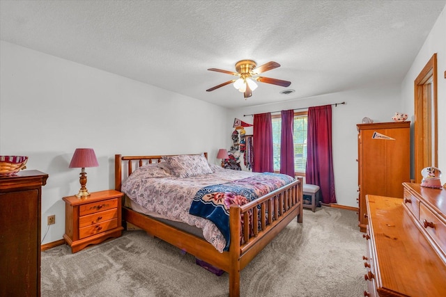 3504 Royal Oak Ct, Champaign, IL 61822 - bedroom with carpet, a textured ceiling, and ceiling fan