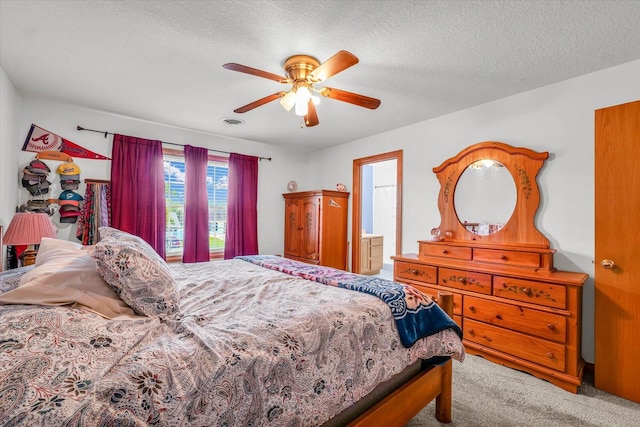 3504 Royal Oak Ct, Champaign, IL 61822 - bedroom with carpet floors, ceiling fan, and a textured ceiling