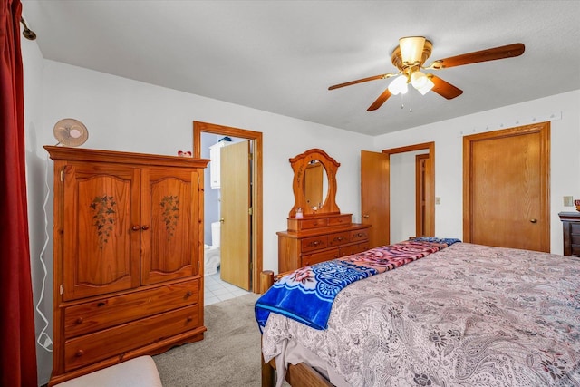 3504 Royal Oak Ct, Champaign, IL 61822 - bedroom featuring light tile patterned flooring, a ceiling fan, and connected bathroom