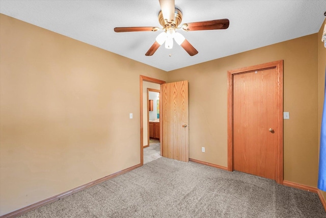 3504 Royal Oak Ct, Champaign, IL 61822 - unfurnished bedroom with carpet, a ceiling fan, and a closet