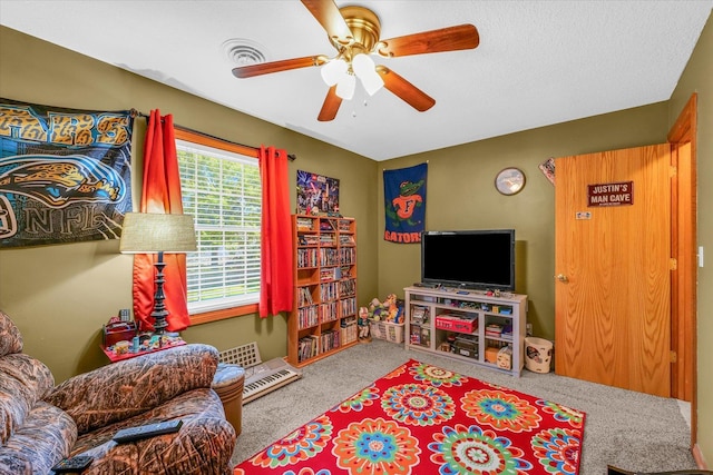 3504 Royal Oak Ct, Champaign, IL 61822 - living area with carpet floors and a ceiling fan