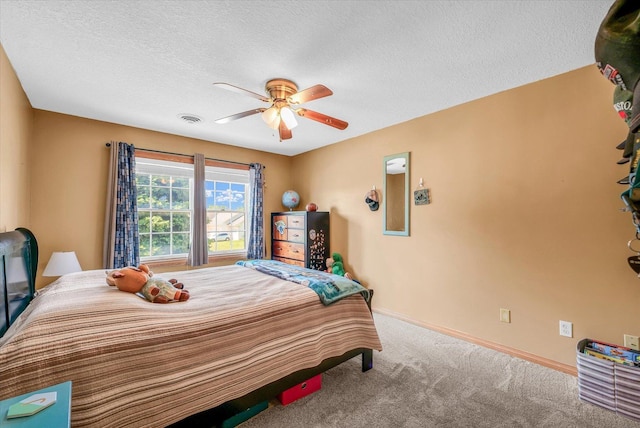 3504 Royal Oak Ct, Champaign, IL 61822 - carpeted bedroom with a ceiling fan and a textured ceiling