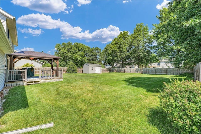 3504 Royal Oak Ct, Champaign, IL 61822 - fenced backyard with a gazebo, a shed, and a deck