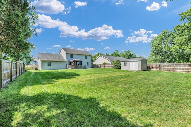 3504 Royal Oak Ct, Champaign, IL 61822 - fenced backyard featuring a storage unit and a gazebo