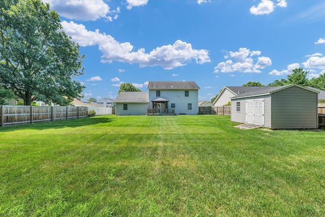 3504 Royal Oak Ct, Champaign, IL 61822 - back of property featuring a storage unit, a fenced backyard, and a gazebo