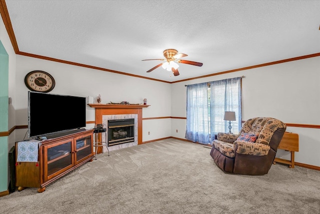 3504 Royal Oak Ct, Champaign, IL 61822 - living area featuring ceiling fan, carpet floors, a fireplace, crown molding, and a textured ceiling
