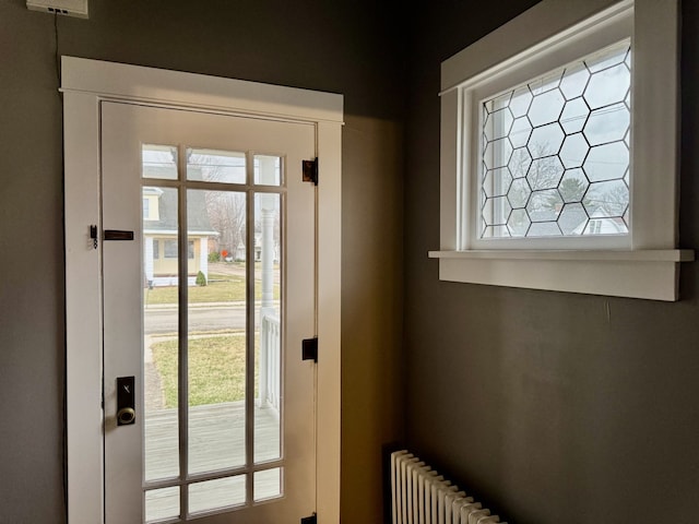 doorway to outside featuring radiator
