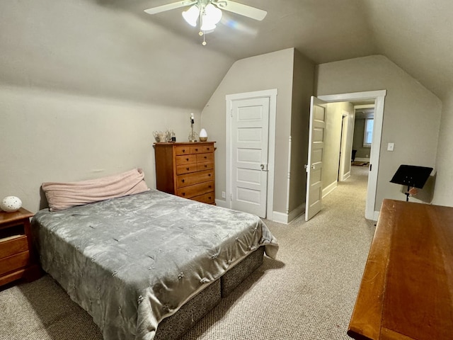 bedroom featuring vaulted ceiling, light colored carpet, baseboards, and ceiling fan