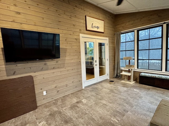 unfurnished sunroom with french doors