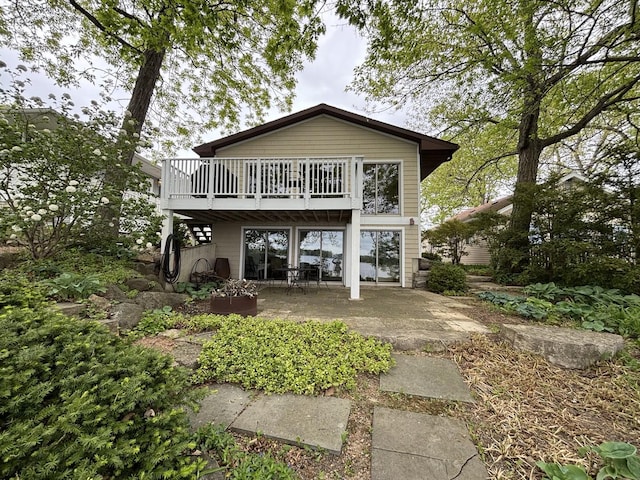 24109 64th Pl, Paddock Lake, WI 53168 - rear view of house with a wooden deck and a patio area