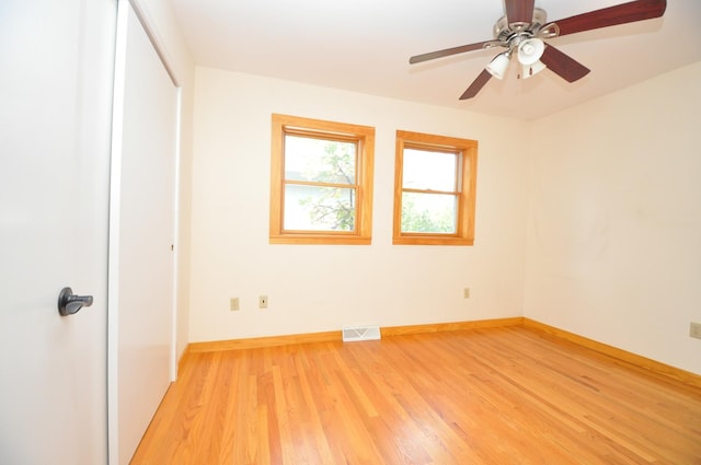 24109 64th Pl, Paddock Lake, WI 53168 - unfurnished bedroom featuring light wood-type flooring, baseboards, a closet, and ceiling fan