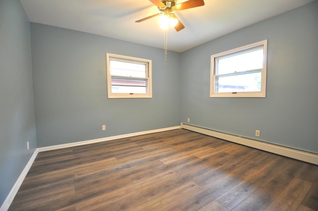24109 64th Pl, Paddock Lake, WI 53168 - unfurnished room with baseboard heating, healthy amount of natural light, a ceiling fan, and wood finished floors