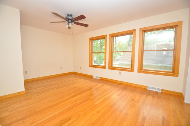 24109 64th Pl, Paddock Lake, WI 53168 - unfurnished room featuring baseboards, light wood-style floors, and a ceiling fan