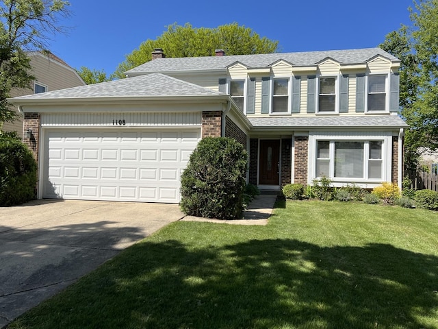 1108 N Devonshire Rd, Buffalo Grove, IL 60089 - traditional-style house with concrete driveway, an attached garage, a front lawn, brick siding, and roof with shingles