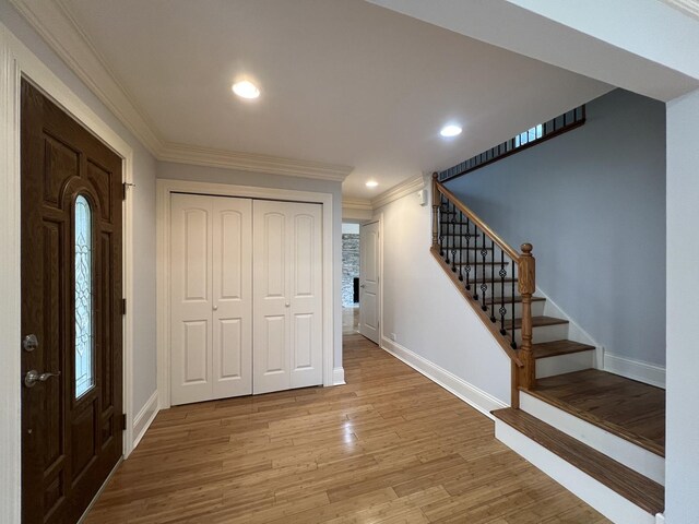 1108 N Devonshire Rd, Buffalo Grove, IL 60089 - foyer featuring crown molding, baseboards, light wood-type flooring, stairway, and recessed lighting