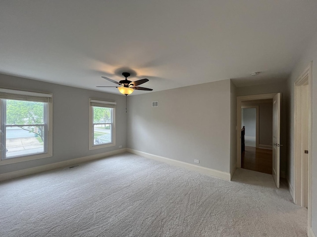 1108 N Devonshire Rd, Buffalo Grove, IL 60089 - unfurnished room with light carpet, baseboards, and a ceiling fan