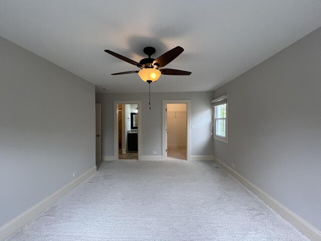 1108 N Devonshire Rd, Buffalo Grove, IL 60089 - unfurnished room with ceiling fan, baseboards, and light carpet
