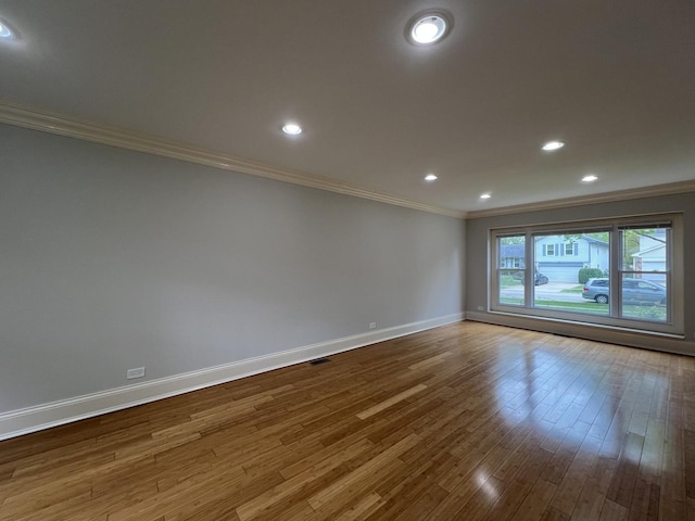1108 N Devonshire Rd, Buffalo Grove, IL 60089 - unfurnished room with ornamental molding, baseboards, wood finished floors, and recessed lighting