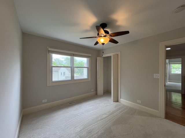 1108 N Devonshire Rd, Buffalo Grove, IL 60089 - unfurnished bedroom with carpet, baseboards, and a ceiling fan