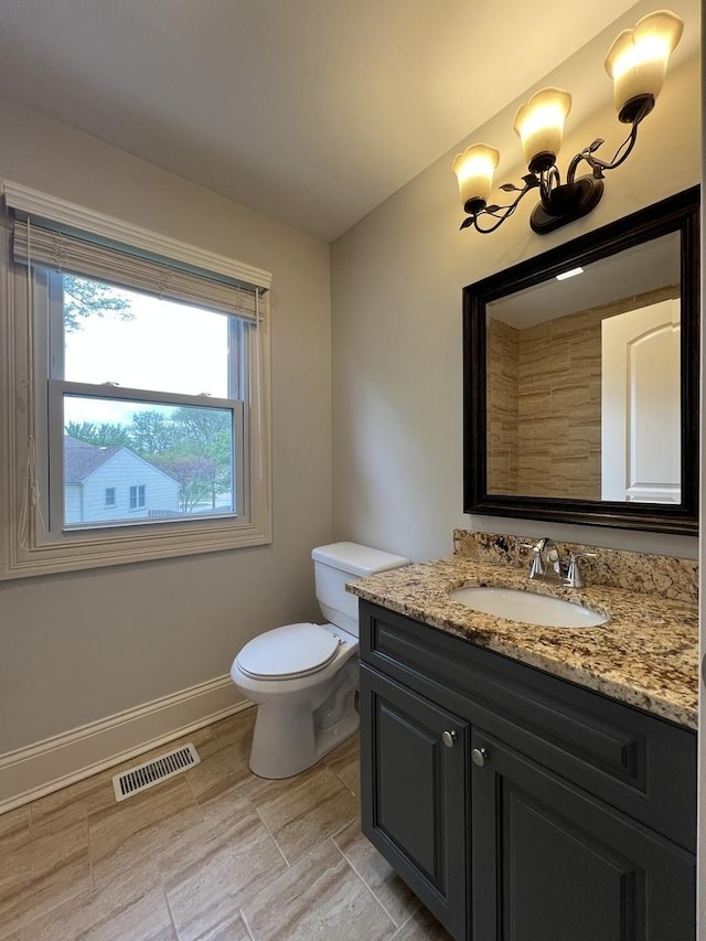 1108 N Devonshire Rd, Buffalo Grove, IL 60089 - bathroom with baseboards, toilet, vanity, and a chandelier