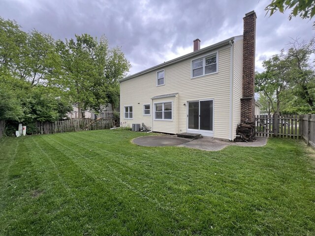 1108 N Devonshire Rd, Buffalo Grove, IL 60089 - rear view of house with a chimney, a patio, and central AC unit