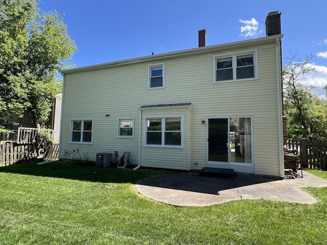 1108 N Devonshire Rd, Buffalo Grove, IL 60089 - back of property featuring a chimney, cooling unit, and a patio