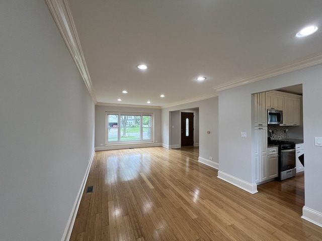 1108 N Devonshire Rd, Buffalo Grove, IL 60089 - unfurnished living room featuring ornamental molding, baseboards, light wood-style floors, and recessed lighting