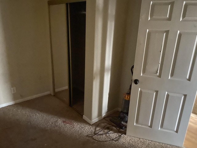hallway featuring baseboards