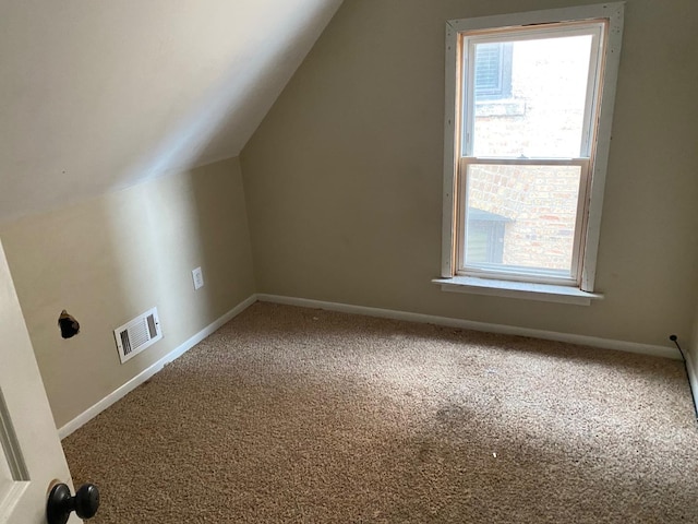 bonus room featuring vaulted ceiling, visible vents, baseboards, and carpet floors