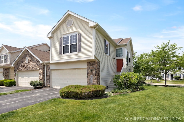 2319 Georgetown Ct, Aurora, IL 60503 - view of front of house with a front yard, stone siding, driveway, and an attached garage