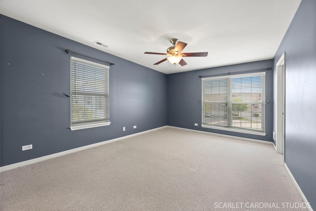 2319 Georgetown Ct, Aurora, IL 60503 - spare room featuring ceiling fan and light carpet