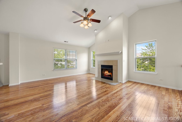 2319 Georgetown Ct, Aurora, IL 60503 - unfurnished living room featuring a fireplace, wood finished floors, ceiling fan, and high vaulted ceiling
