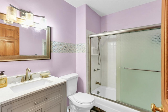 313 W Church St, Savoy, IL 61874 - full bath featuring vanity, combined bath / shower with glass door, and toilet