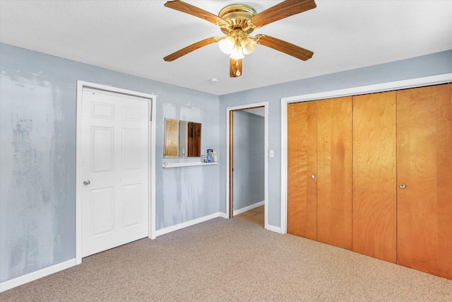 313 W Church St, Savoy, IL 61874 - unfurnished bedroom with baseboards, carpet, and ceiling fan