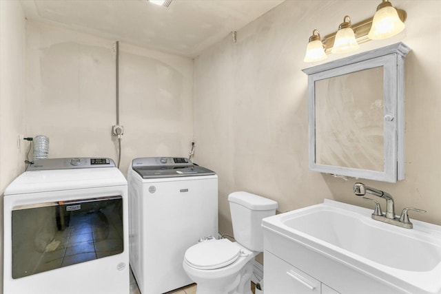 313 W Church St, Savoy, IL 61874 - half bath with a sink, toilet, and independent washer and dryer