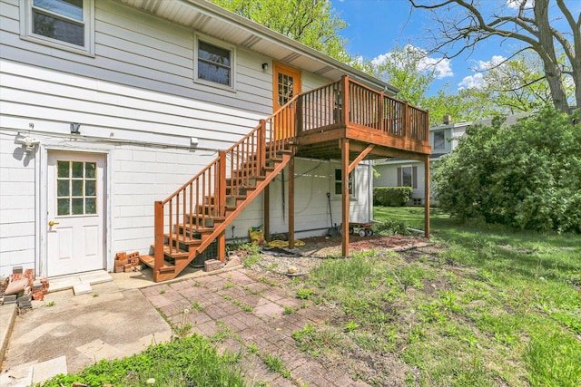 313 W Church St, Savoy, IL 61874 - rear view of house featuring a patio, stairway, and a deck