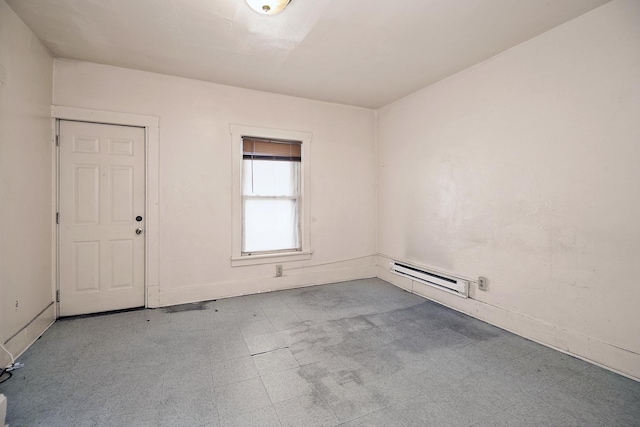 spare room with tile patterned floors and a baseboard radiator