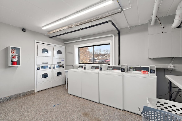254 E Bailey Rd Unit M, Naperville, IL 60565 - shared laundry area with washer and dryer, stacked washing maching and dryer, and baseboards