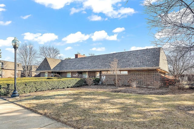 254 E Bailey Rd Unit M, Naperville, IL 60565 - ranch-style house featuring a chimney, a front yard, and brick siding