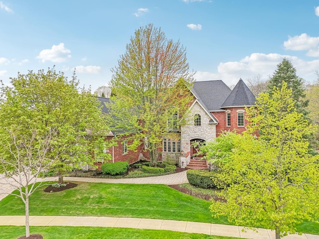 831 Alberosky Way, Batavia, IL 60510 - view of front of house with a front yard, stone siding, and brick siding