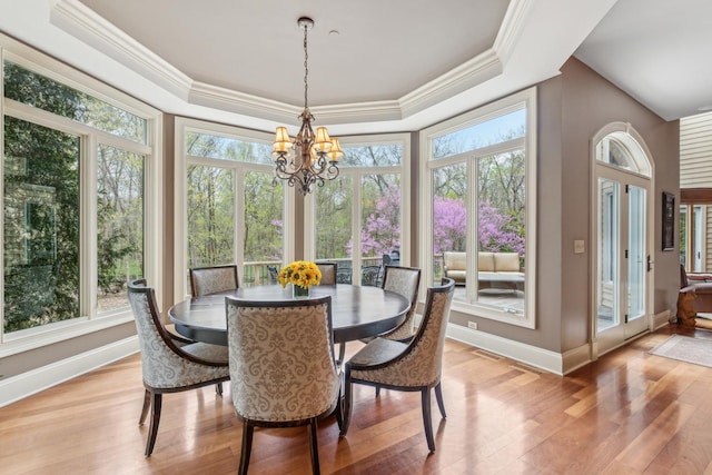831 Alberosky Way, Batavia, IL 60510 - dining room featuring plenty of natural light, ornamental molding, light wood-type flooring, baseboards, and a tray ceiling