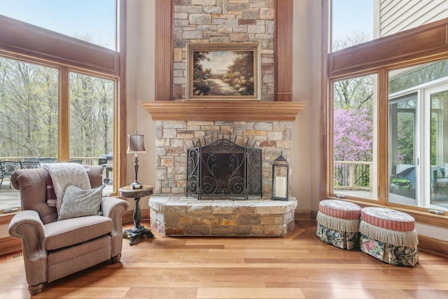 831 Alberosky Way, Batavia, IL 60510 - sitting room featuring wood finished floors, a fireplace, a high ceiling, and healthy amount of natural light