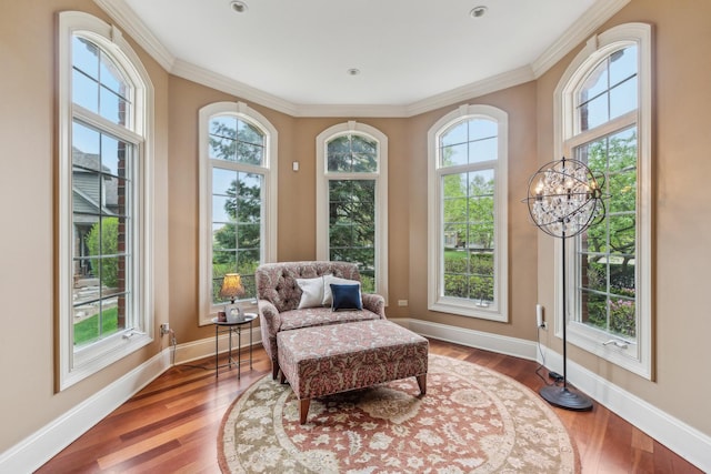 831 Alberosky Way, Batavia, IL 60510 - living area with crown molding, baseboards, wood finished floors, and a chandelier