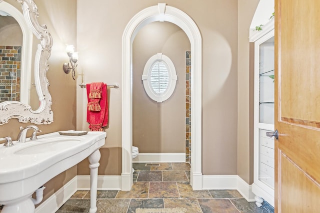 831 Alberosky Way, Batavia, IL 60510 - bathroom featuring stone tile floors, baseboards, and toilet
