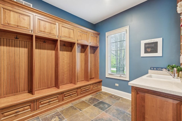 831 Alberosky Way, Batavia, IL 60510 - mudroom featuring baseboards, a sink, and dark stone finish flooring